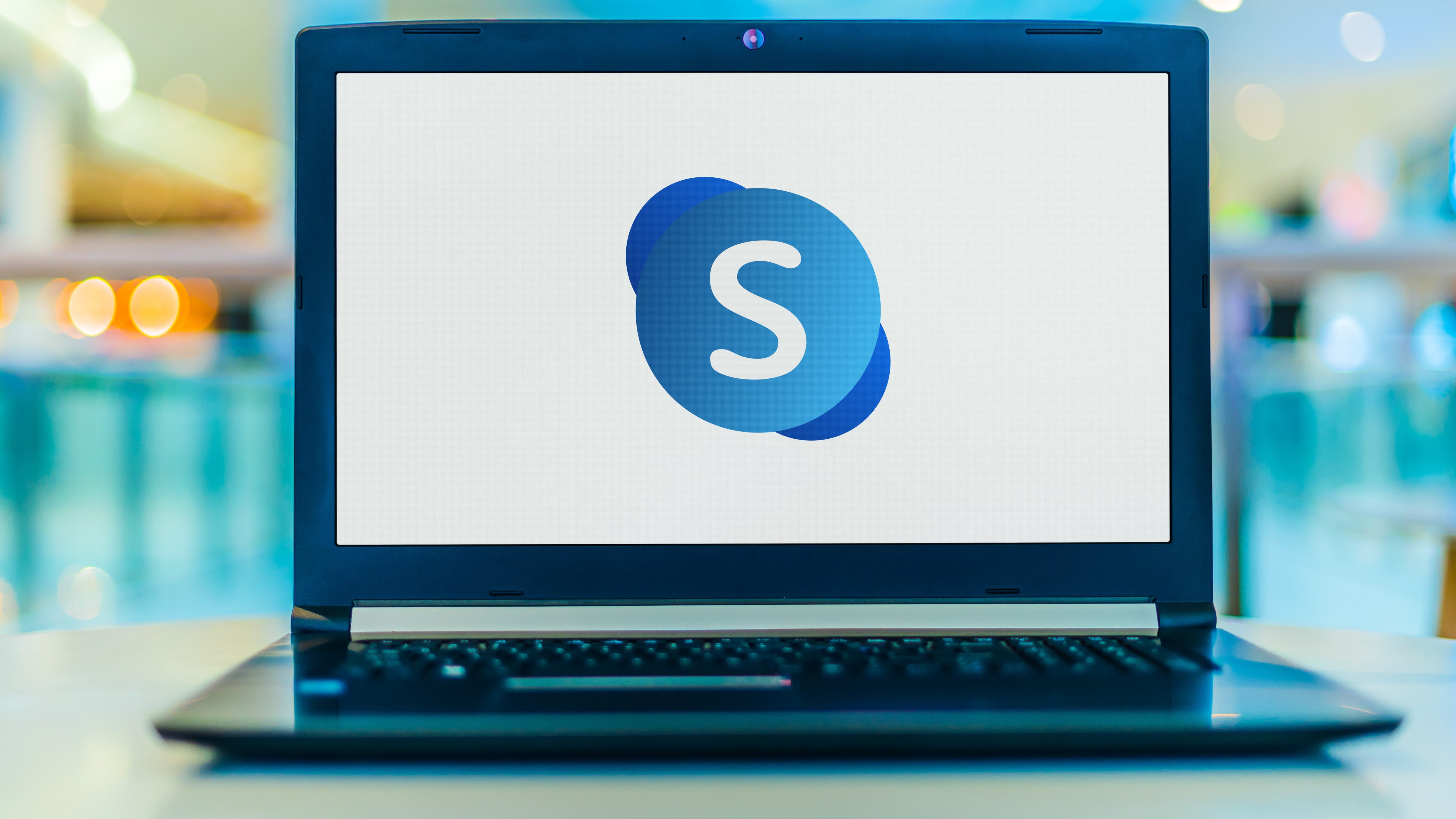 Laptop computer displaying logo of Skype for Business Server, part of the Office family software and services developed by Microsoft