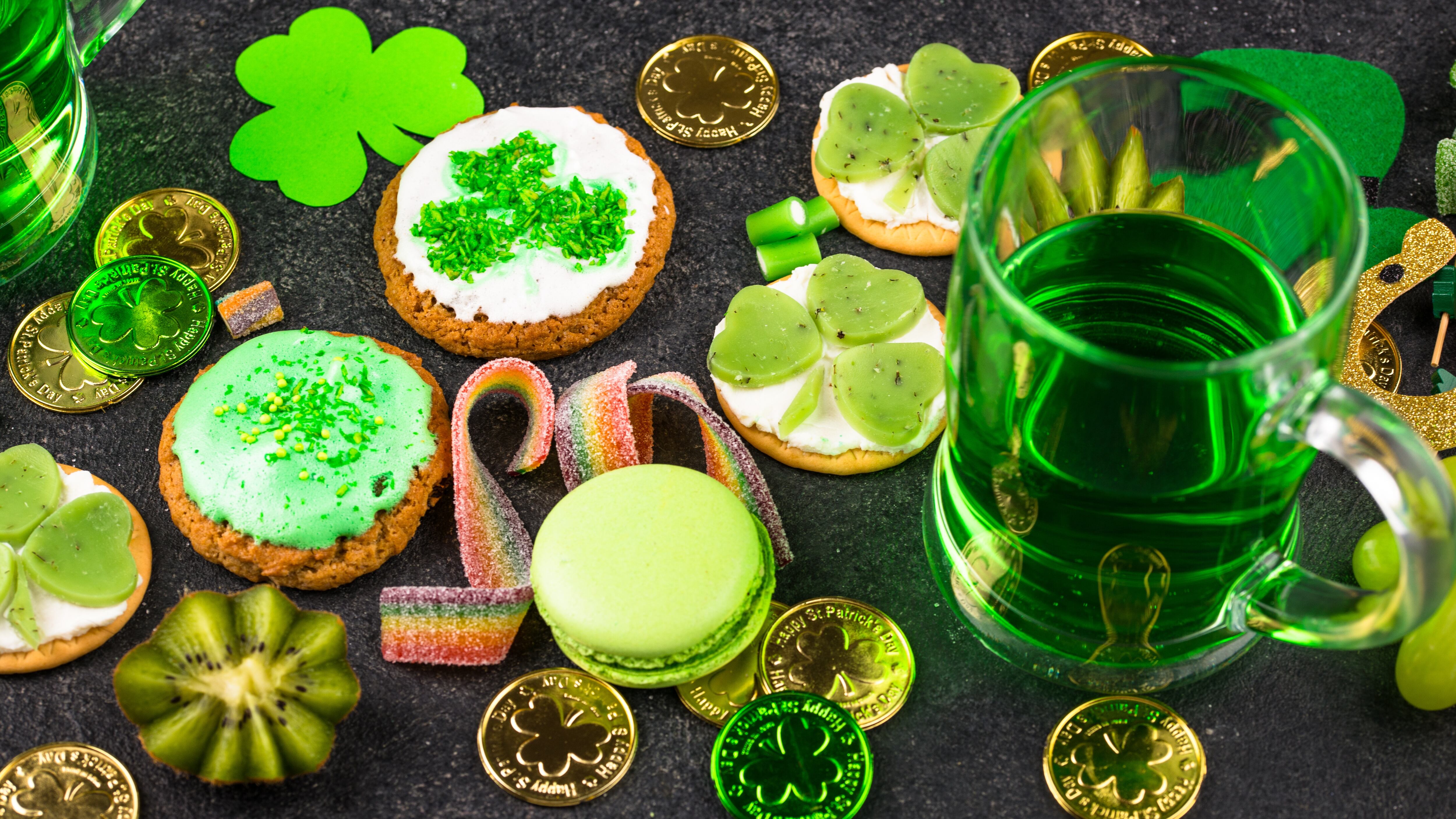 St. Patrick's Day party food, different appetizers with green beer, decoration, and shamrocks